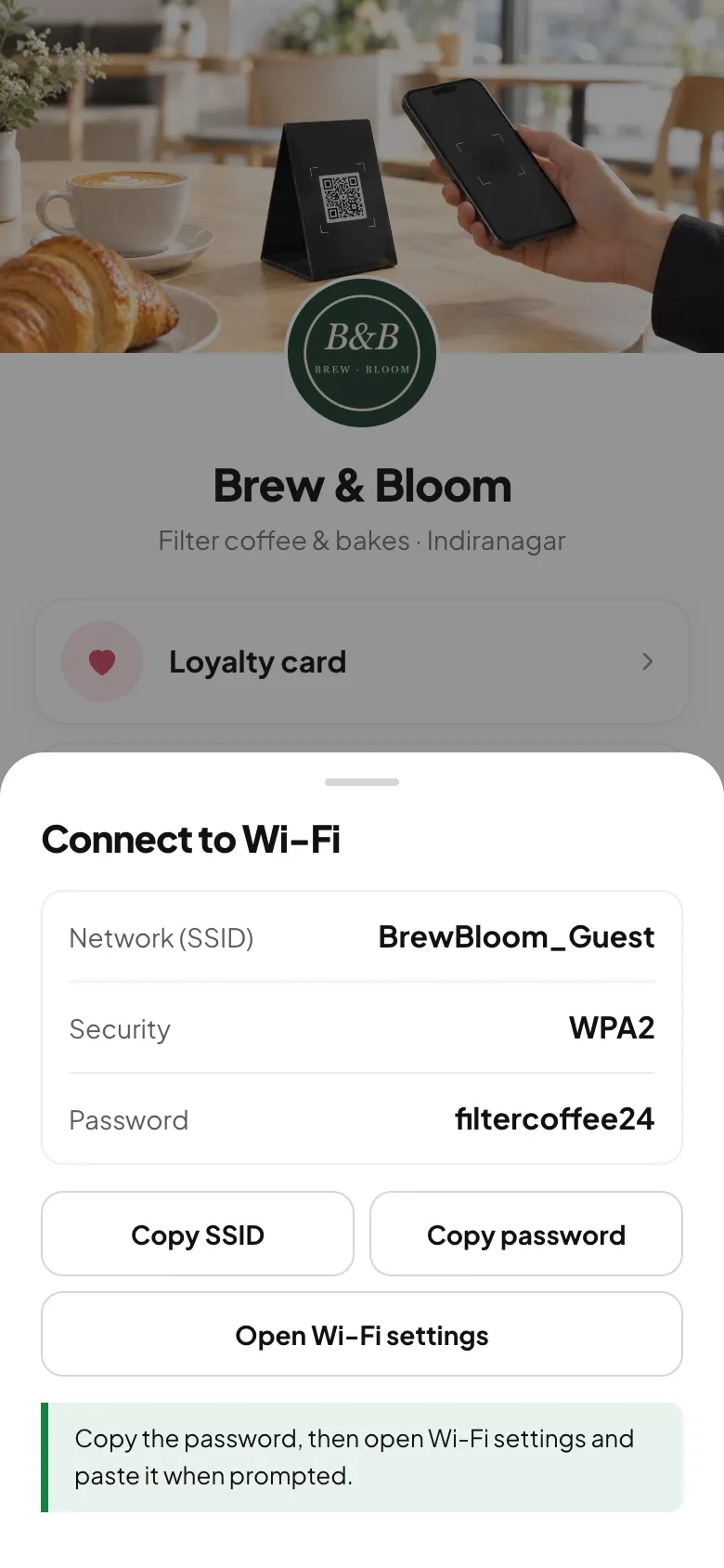 The Connect to Wi-Fi sheet on a phone, showing the network name, security type, password and copy buttons